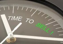 Clock face with "Time to Sell" message