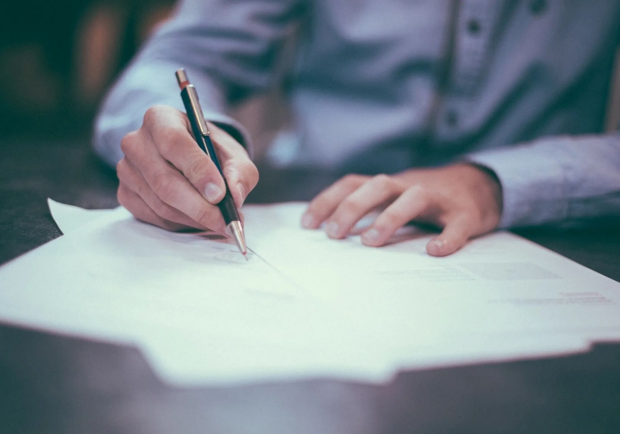 Man working on paperwork at desk